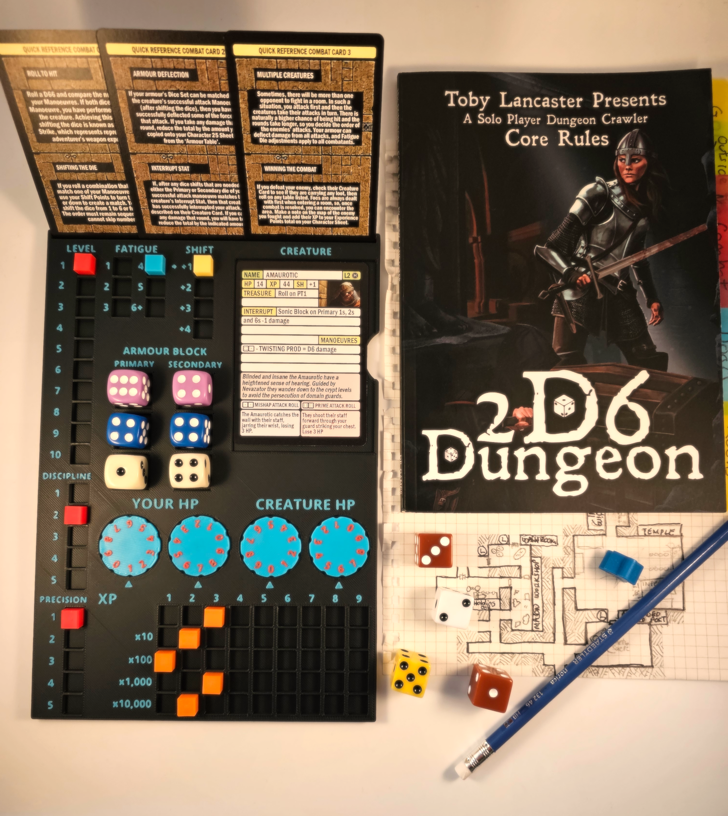 A photo of the 2D6 Dungeon Player Dashboard game set, including the player dashboard, radial counters, and cubes in various colors, alongside a rulebook and dice.